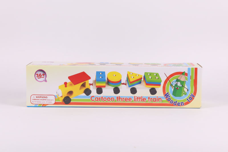 Box of a cartoon three little train wooden toy on a wooden surface with a white background