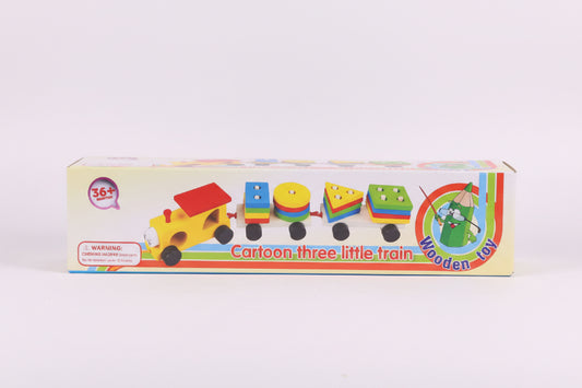Box of a cartoon three little train wooden toy on a wooden surface with a white background
