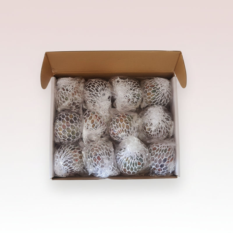 Box containing multiple wrapped items in a net-like packaging