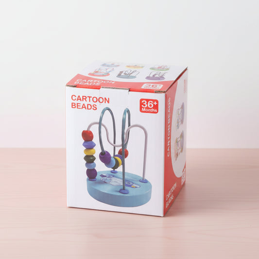 Cartoon beads toy packaging on a wooden surface with a white background