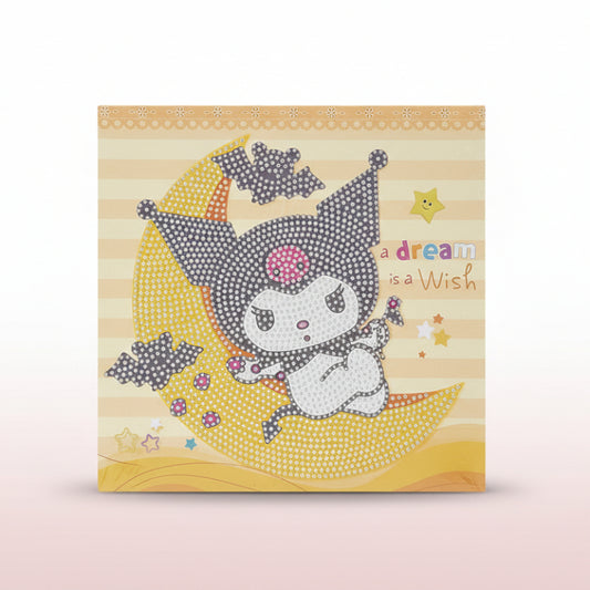 Card with a cartoon character on a moon, text 'A dream is a wish', on a wooden surface.