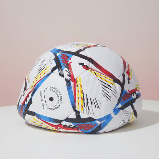 Colorful helmet with abstract design on a wooden surface
