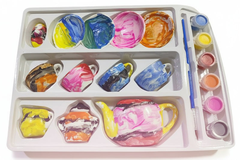 Artistic depiction of ceramic mugs with colorful glazes on a paint palette.