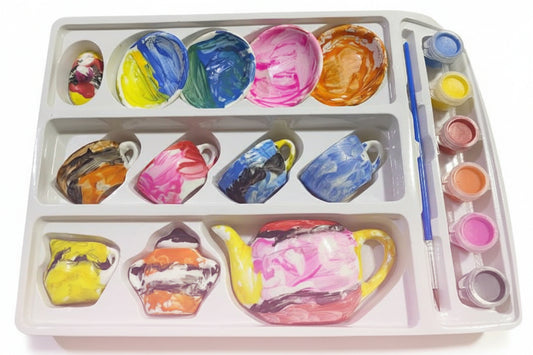 Artistic depiction of ceramic mugs with colorful glazes on a paint palette.