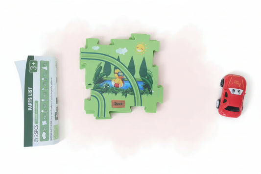 Toy car next to a partially open package with a green toy on a wooden surface