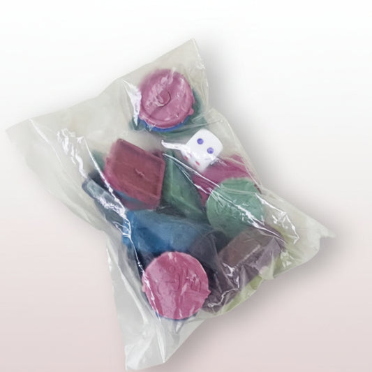 Colorful buttons in a clear plastic bag on a textured surface