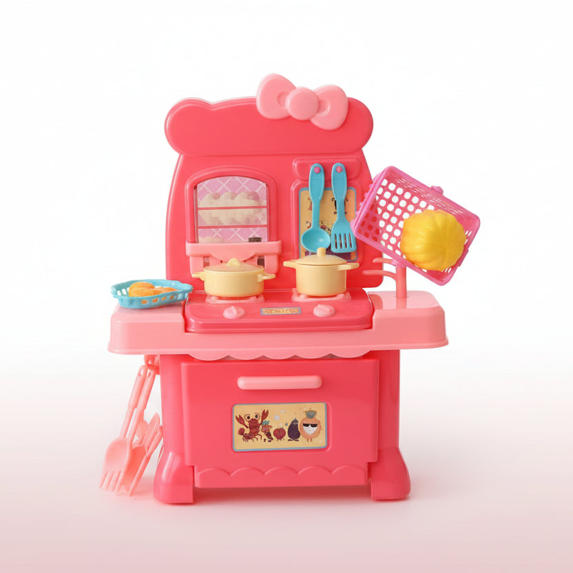 Toy kitchen set in packaging with a red cabinet and toy utensils on a wooden surface.