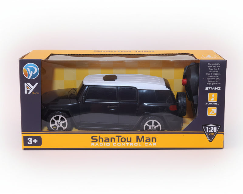 Model car in packaging with 'ShanTou Man' branding on a wooden surface.