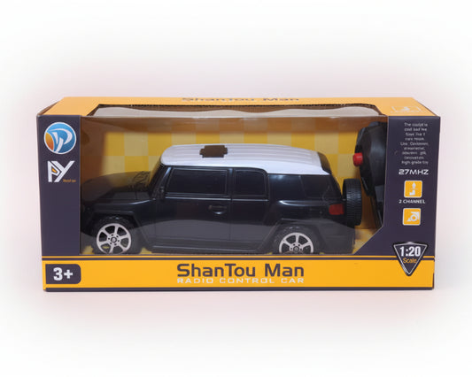 Model car in packaging with 'ShanTou Man' branding on a wooden surface.