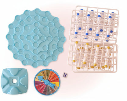 Collection of educational tools including a blue mold, color wheel, and grid with small figures on a wooden surface.
