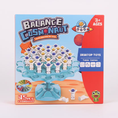Balance Cosmonaut toy packaging with astronaut figures on a blue platform.