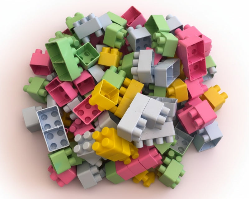 Colorful plastic building blocks in a clear plastic bag