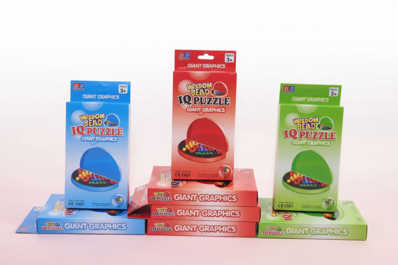 Collection of Giant Graphics IQ Puzzle boxes in various colors on a wooden surface.