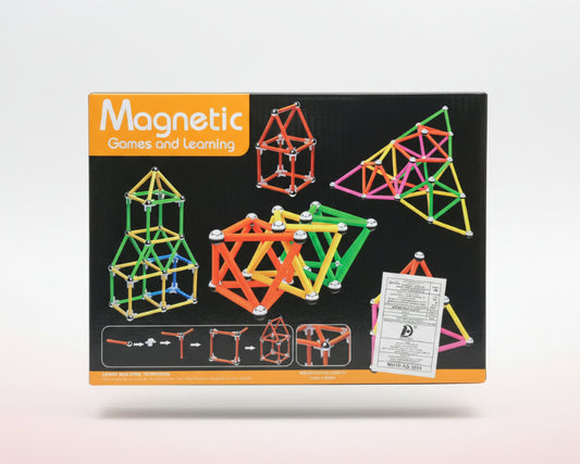 Box of Magnetic Games and Learning set with colorful magnetic building toys on a wooden surface