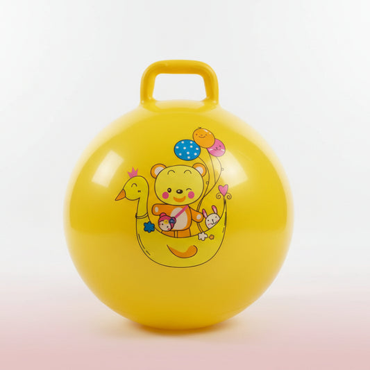 Yellow inflatable ball with cartoon character on a wooden surface