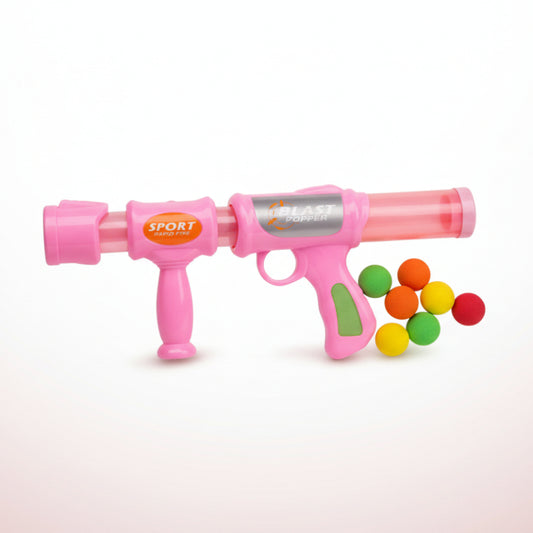 Two pink toy guns with colorful balls on a clear plastic bag against a white background.