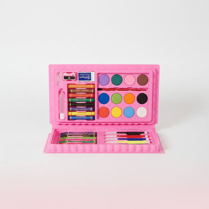 Pink art kit with crayons, markers, and paint on a wooden surface