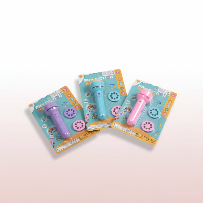 Stack of toy microphones with packaging on a wooden surface