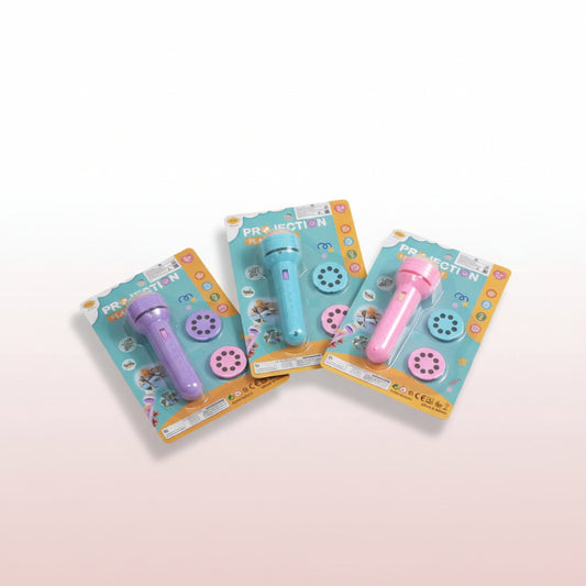 Stack of toy microphones with packaging on a wooden surface