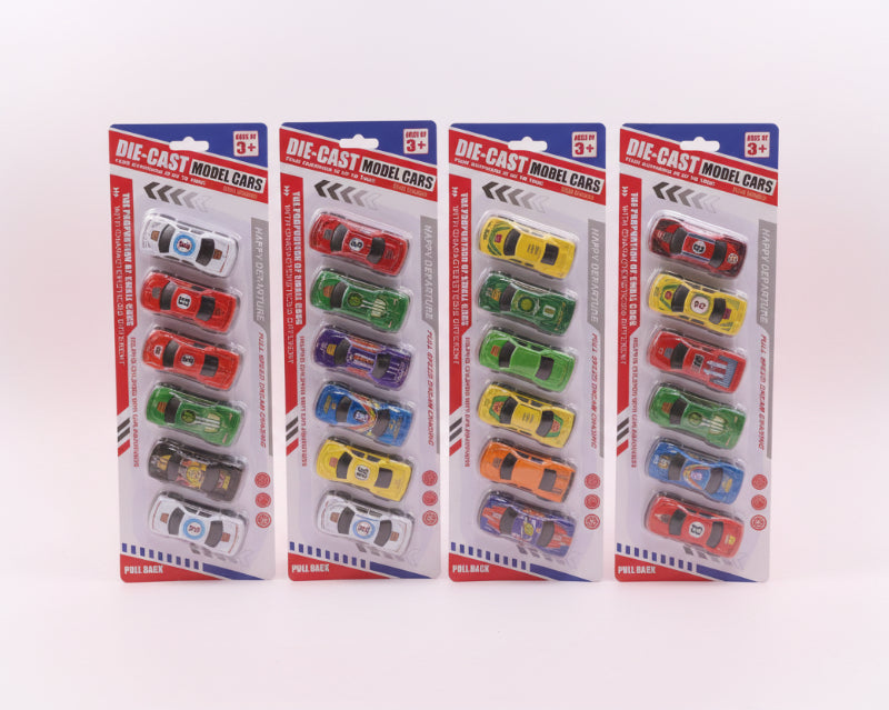 Four packages of die-cast model cars on a wooden surface with a neutral background.
