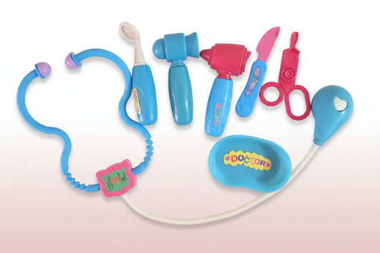 Set of toy medical tools on a wooden surface