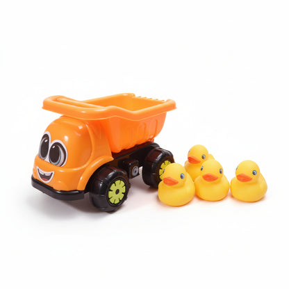 Orange toy dump truck with yellow rubber ducks on a wooden surface