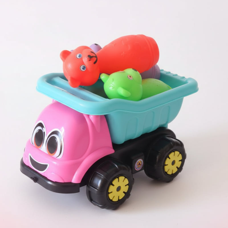 Toy scooter with bath toys in a clear plastic bag on a wooden surface.