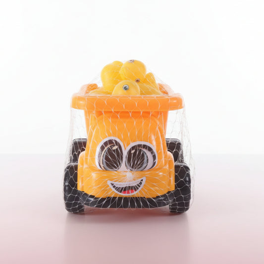 Yellow toy truck with a face design on a wooden surface