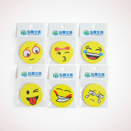 Set of six yellow smiley face stickers on clear cards with brand name on a wooden surface