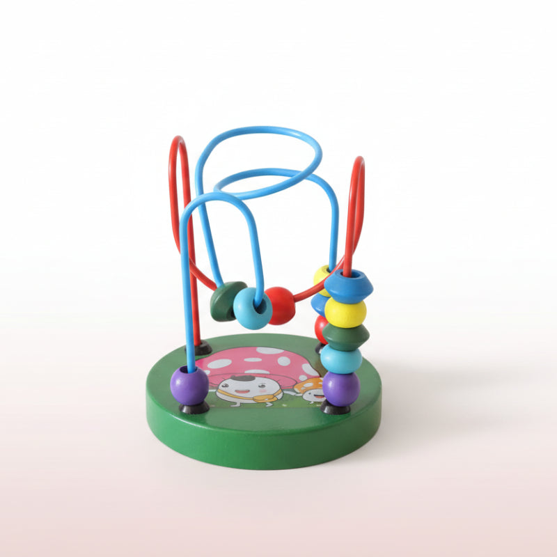 Colorful bead maze toy on a wooden surface with a plain background