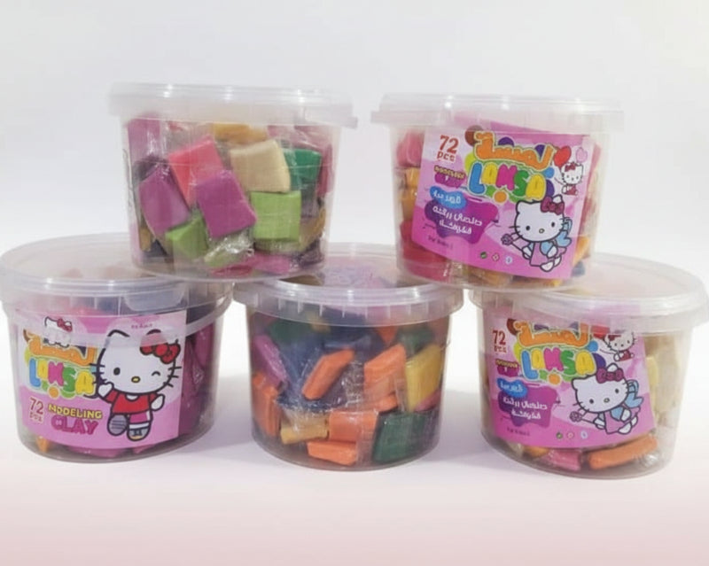 Five containers of colorful clay with Hello Kitty branding on a wooden surface.
