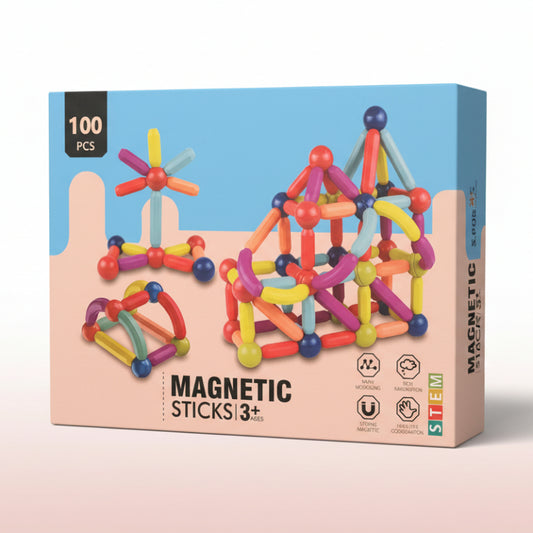 Box of colorful magnetic sticks toy set with building structures on a blue and pink background.