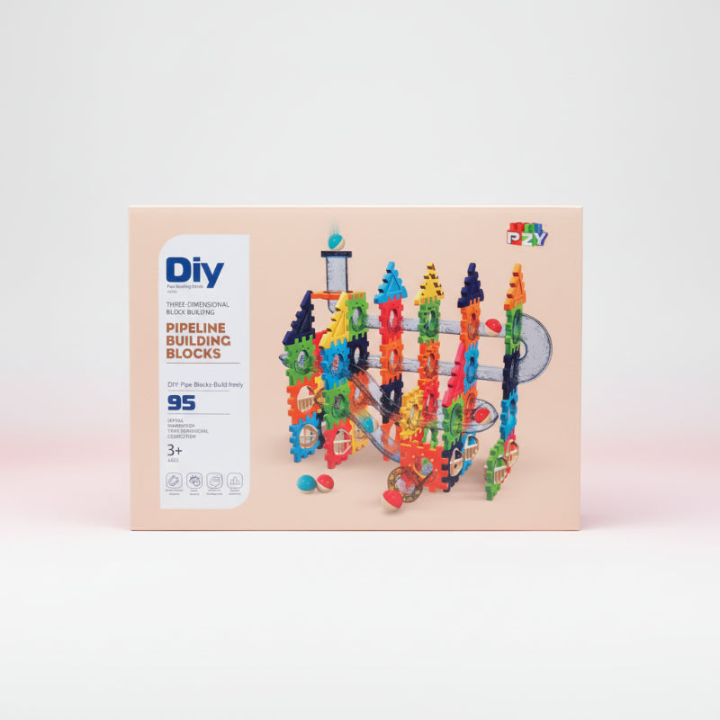 Box of DIY pipeline building blocks with colorful design on a wooden surface.