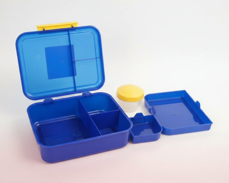 Blue plastic container with compartments and yellow lid on a wooden surface