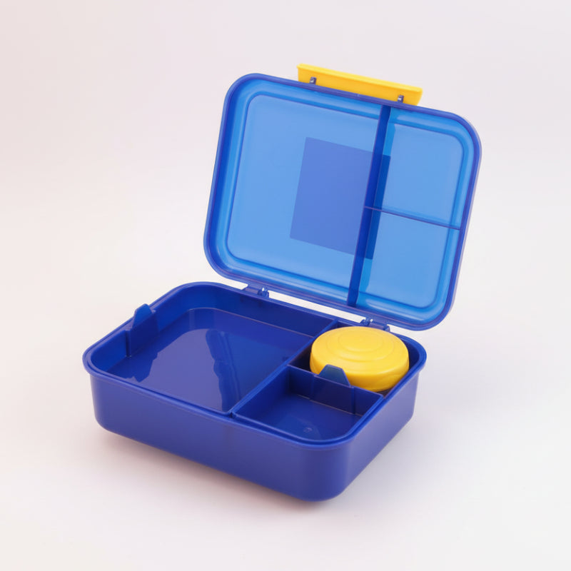 Blue bento box with a yellow lid and compartment on a wooden surface.