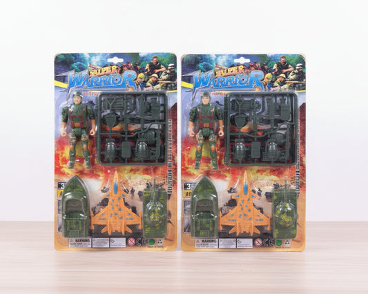 Two packages of Super Warrior action figures on a wooden surface with a white background
