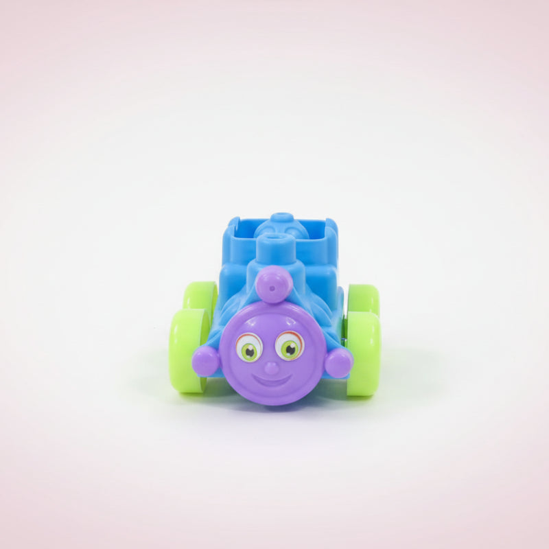 Toy train made of interlocking blocks on a wooden surface with a white background