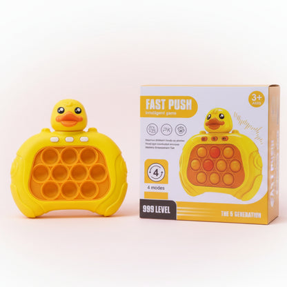 Yellow duck-shaped pop-it toy with packaging on a wooden surface