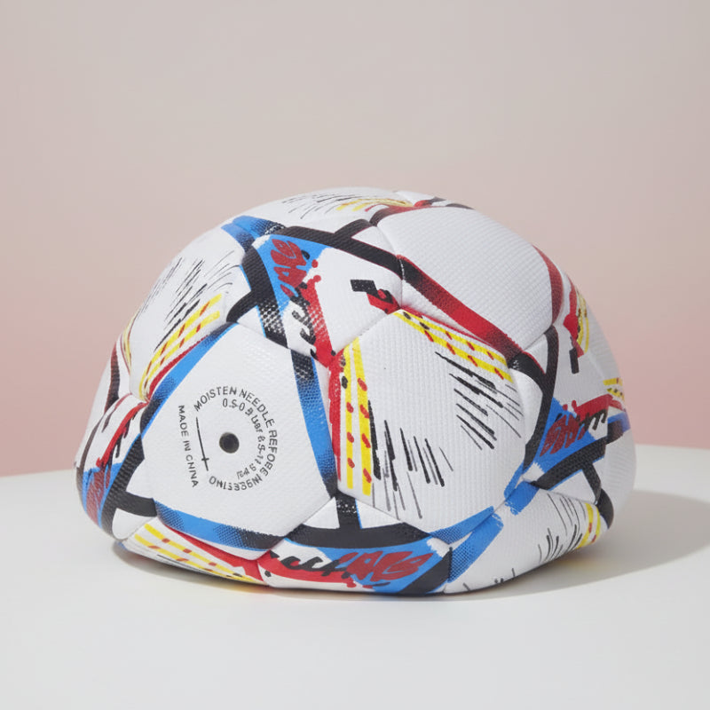 Colorful helmet with abstract design on a wooden surface