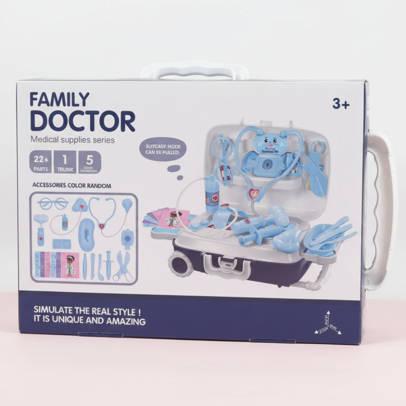 Box of a toy medical set titled 'Family Doctor' on a wooden surface.