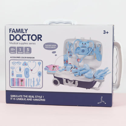 Box of a toy medical set titled 'Family Doctor' on a wooden surface.