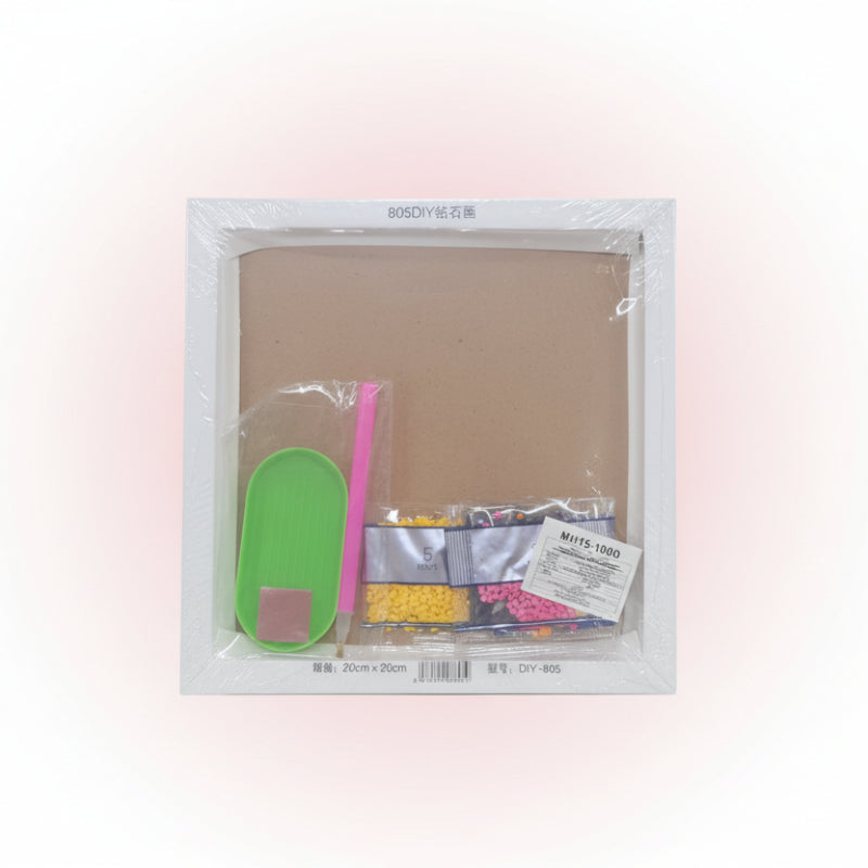 Packaged diamond painting kit with materials inside, on a wooden surface.