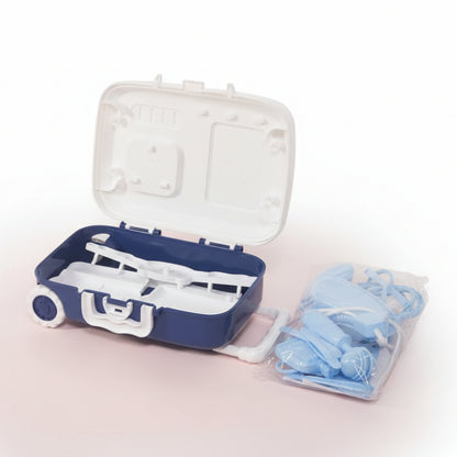 Blue and white case with dental tools and a clear package of additional blue tools on a wooden surface.