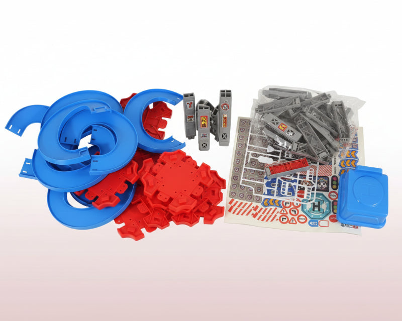 Toy building set with blue, red, and gray components on a wooden surface.