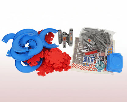 Toy building set with blue, red, and gray components on a wooden surface.