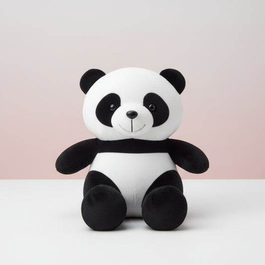 Plush panda toy on a wooden surface with a white background