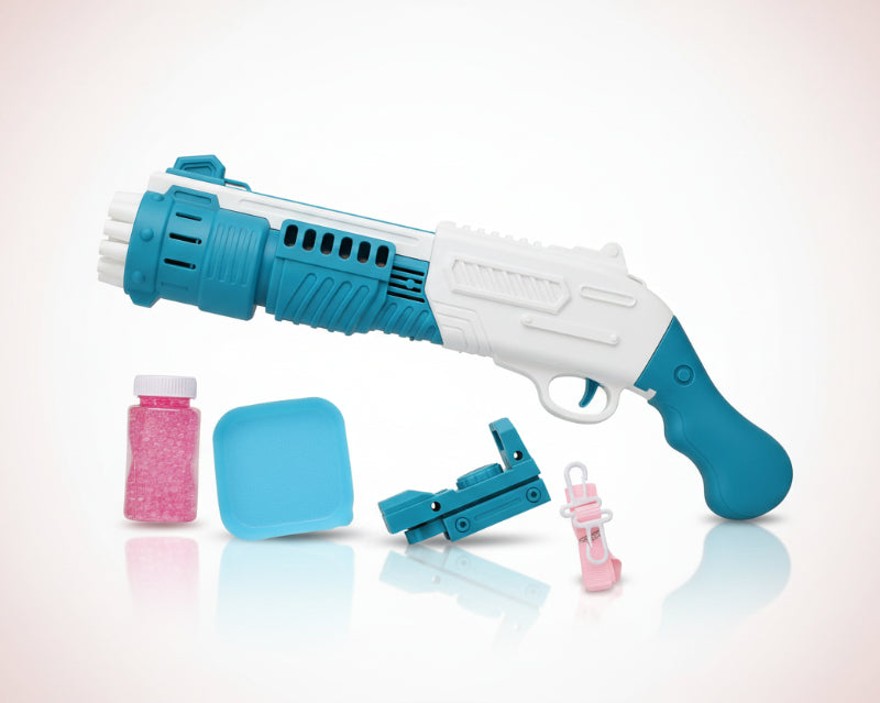 Toy gun with accessories on a clear plastic sheet over a wooden surface