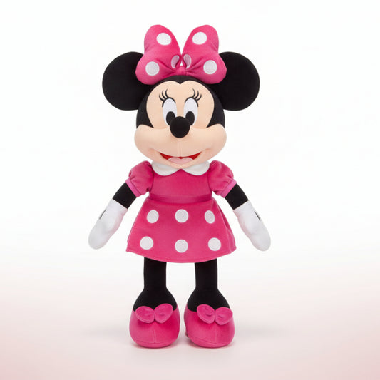 Plush toy of a character in a pink dress with a bow on a white background