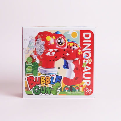 Box of a dinosaur-themed bubble gun toy on a wooden surface.