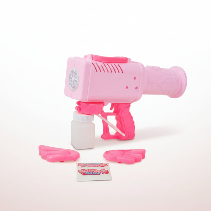 Pink toy gun with accessories on a wooden surface